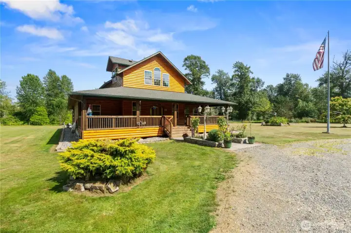Beautiful entry with large, covered deck to enjoy the sitting outside all year long. Beautiful entry with large, covered deck to enjoy the sitting outside all year long.
