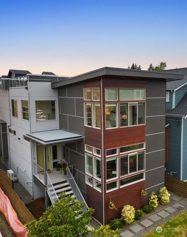 East-facing covered front porch, beautiful lighting and a fully fenced, low maintenance yard welcome you in!