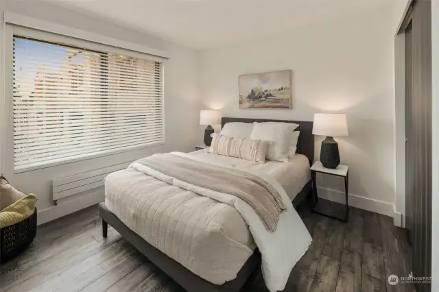 Bedroom #3 on the upper level features a large south facing window with custom blinds and blackout shades and a closet with a light.