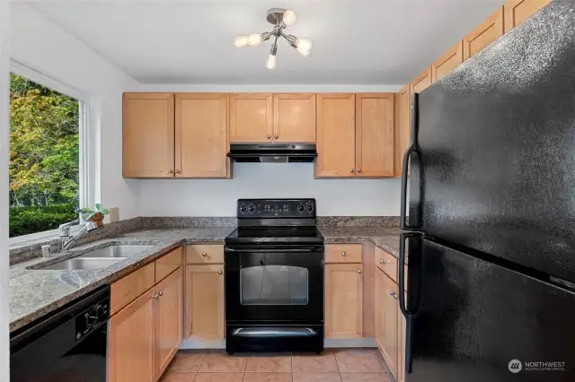 Functional kitchen with modern appliances (all included!) and plenty of cabinet storage for all your cooking needs.