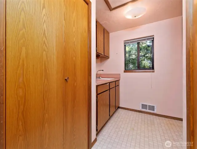 Utility Room with a sink and great storage.