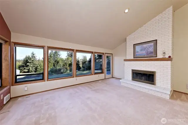 Living room with a wood fireplace.