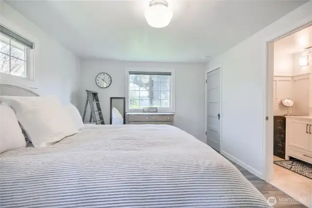 View of primary suite to primary bathroom.