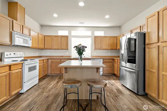 Nice big kitchen with lots of counter and cabinet space! Enjoy your almost brand new fridge!
