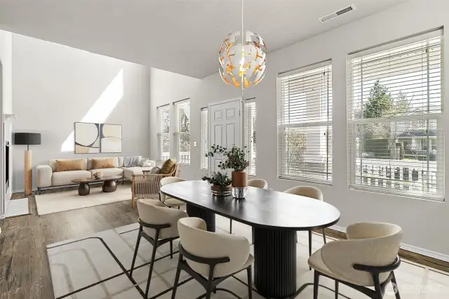 Formal dining room and sitting area on main. Virtually Staged