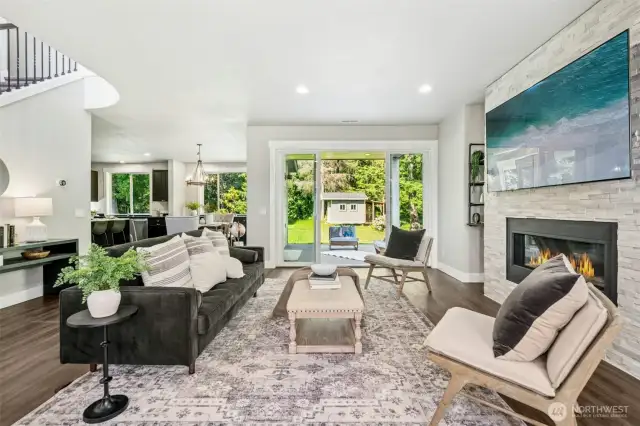 Living room with fireplace & patio access