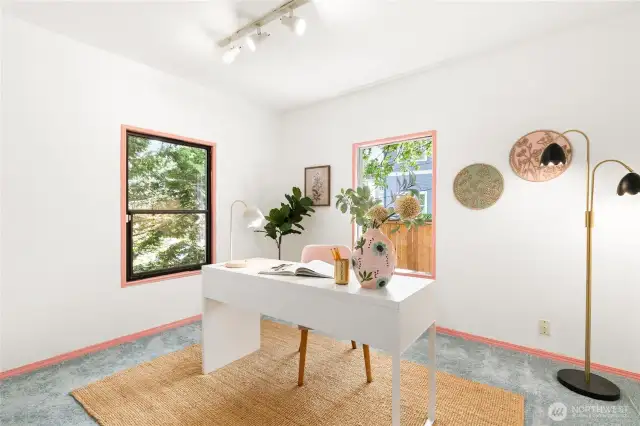The second of the main-level bedrooms gets great natural light and easily fits a queen-sized bed.