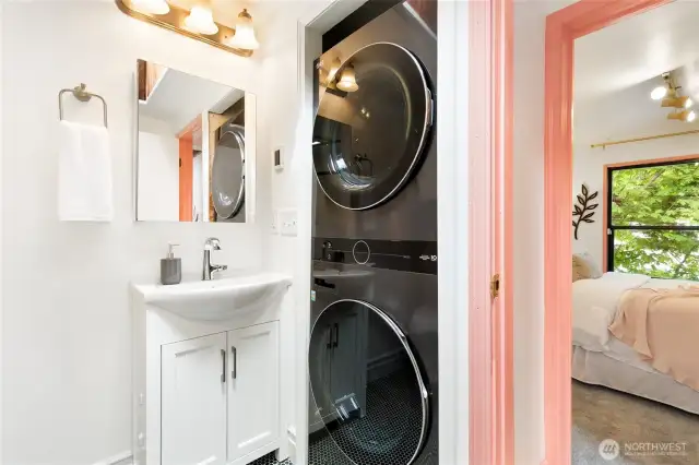 The main level bathroom also has medicine cabinet storage, a new vanity, and a new LG WashTower with extra-large capacity (4.5 cf washer, 7.4 cf dryer) in black steel (both 2023)