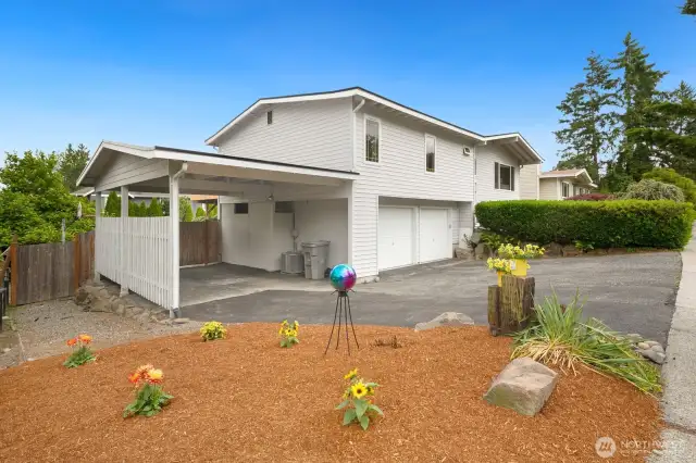 Drive from the carport into the backyard through the door door gate