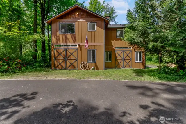 Detached barn with small shop space. 1100 Sq Ft of finished living space upstairs, including a full kitchen and 3/4 bathroom. This building also has new interior and exterior paint, as well as new carpet, and a new deck.