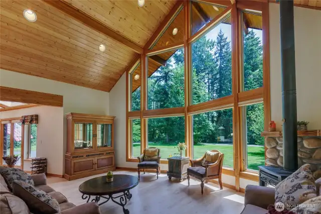 Vaulted ceilings and a wall of windows in the family room. Propane fireplace for those cold nights.