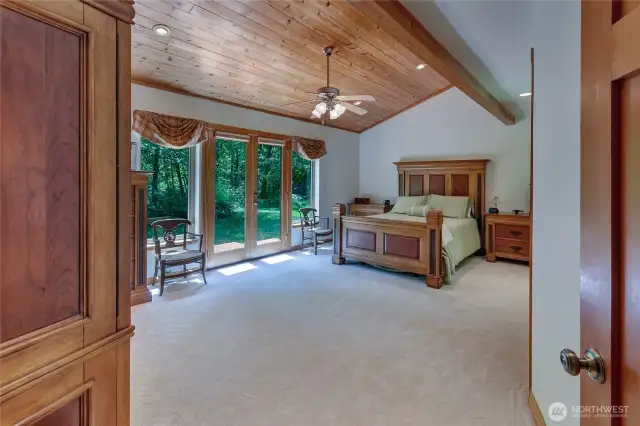 Primary retreat located on the main level. Wood clad ceiling adds to the rustic appeal. New carpet.