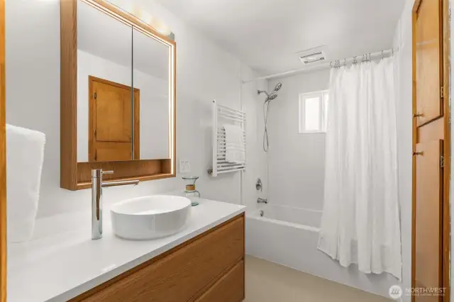 Hallway Guest Bath is brand New! New Tub, new tile surround, flooring & fixtures, new floating vanity