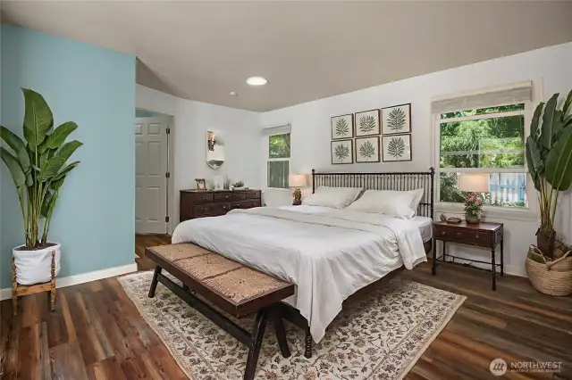 Virtually staged primary bedroom. French doors from this room allow you convenient access to the back yard.