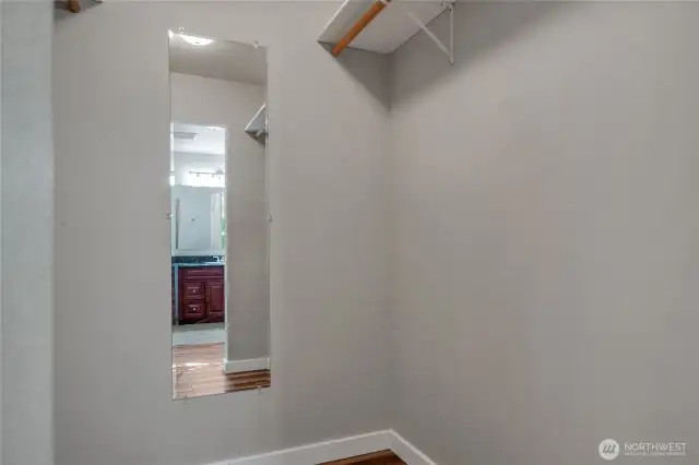 Spacious walk-in primary bedroom closet.
