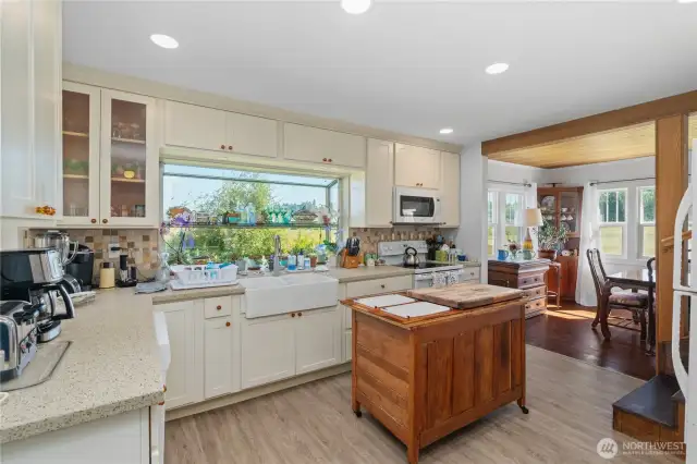 Gorgeous cabinets and custom tile backsplash add so much character