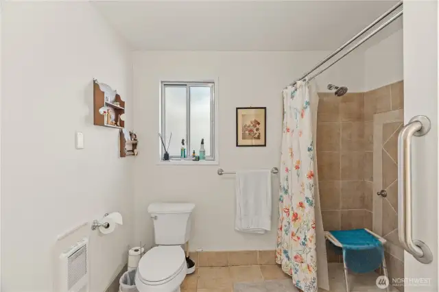 Walk-in tiled shower in 3/4 bath
