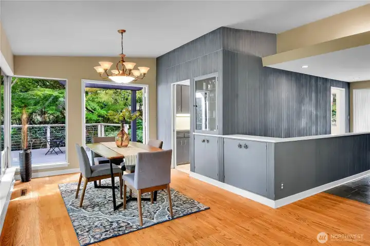 Dining area looking towards 390sf deck and kitchen.  Built in cabinets.