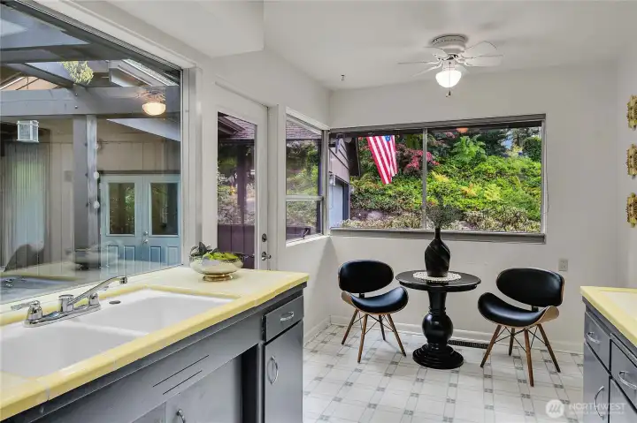 Eating space in kitchen with view to front rockery & landscaping.
