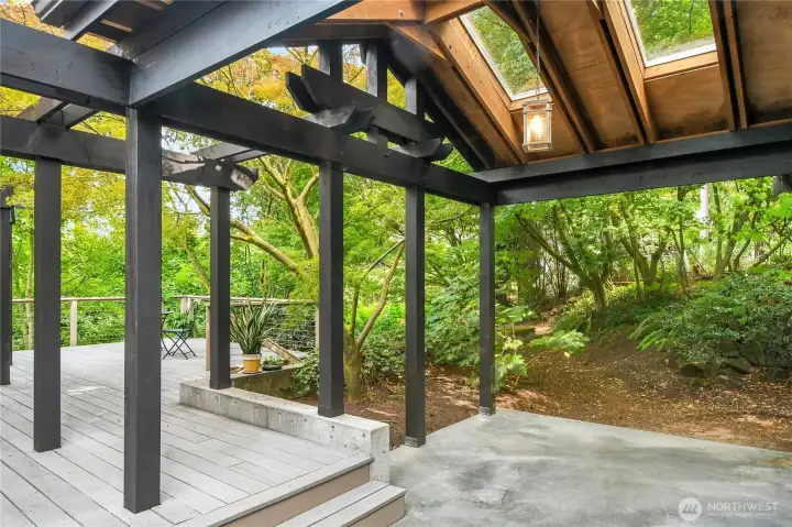 Deck connects with breezeway to double garage.