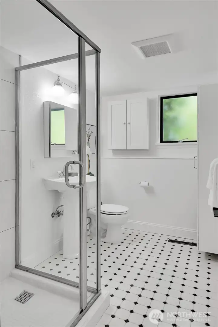 Stylish three quarter bath.
