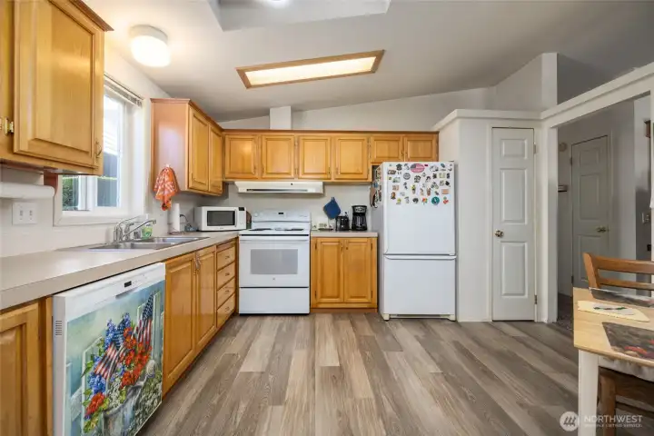 Spacious kitchen has a pantry, newer appliances, and breakfast nook.