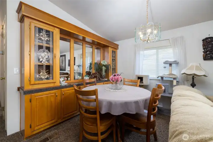 The formal dining area features a built-in china hutch.