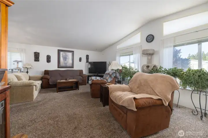 Nice open living area with high ceilings and lots of natural light.