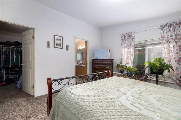 The primary suite has a walk-in closet, and large, private full bathroom.