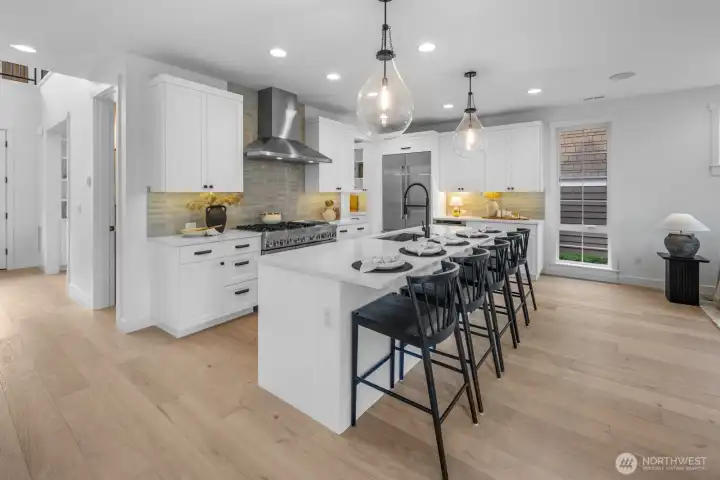 Bright and functional kitchen design with expansive counter space, sleek quartz surfaces, and built-in storage. Perfectly designed for both culinary creativity and casual gatherings.