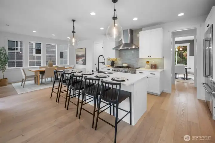 Thoughtful open floor plan with effortless flow between the kitchen, dining, and great room. Perfect for entertaining, while maintaining a warm and livable atmosphere.