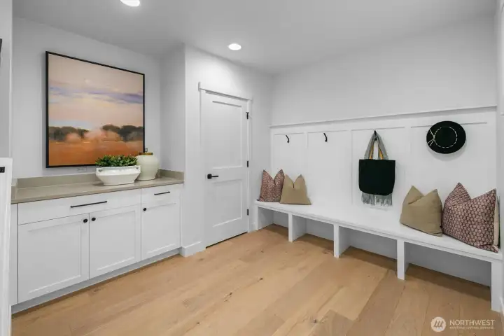 Spacious mudroom with custom built-ins, bench seating, and storage cabinetry—perfect for everyday organization.