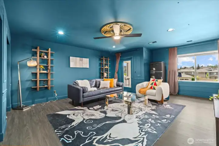 Versatle media room, pre-wired for an immersive surround sound system.