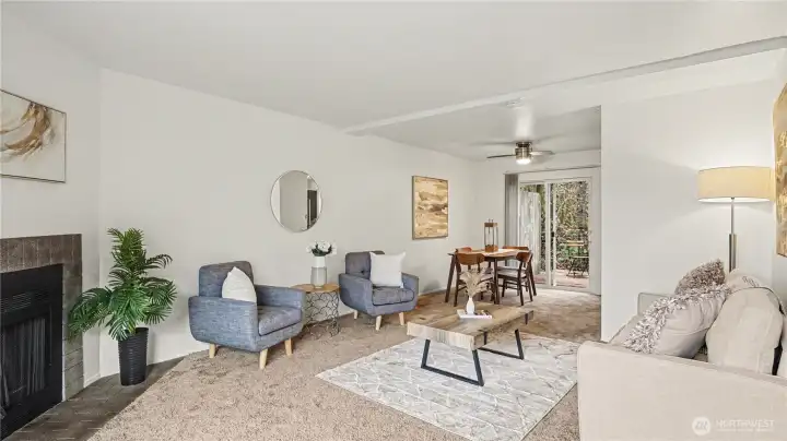Living and dining area seamlessly flow together with private balcony just off the living room