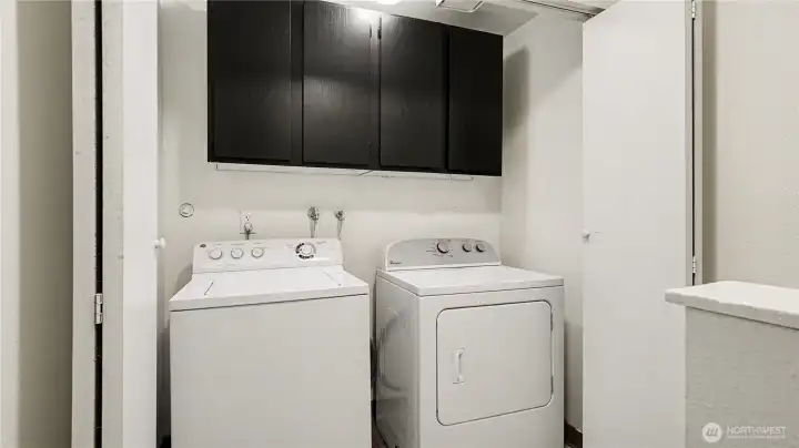 Upstairs laundry with storage for convenance.