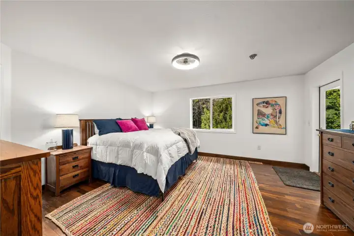 Large primary bedroom with direct backyard access.