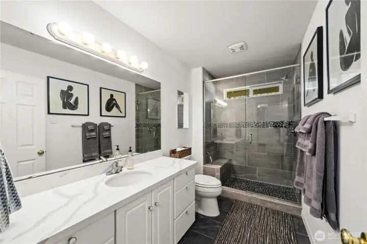 Remodeled guest bathroom with tile surround, walk-in shower!