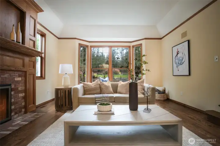 Grand fireplace mantel and gas fireplace in living room