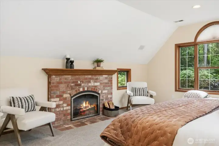 Cozy fireplace in primary bedroom