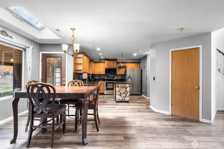 Natural light from the skylight and backyard-facing windows keeps the space feeling bright and open