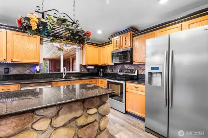 The central island offers additional prep space and a natural spot to gather,