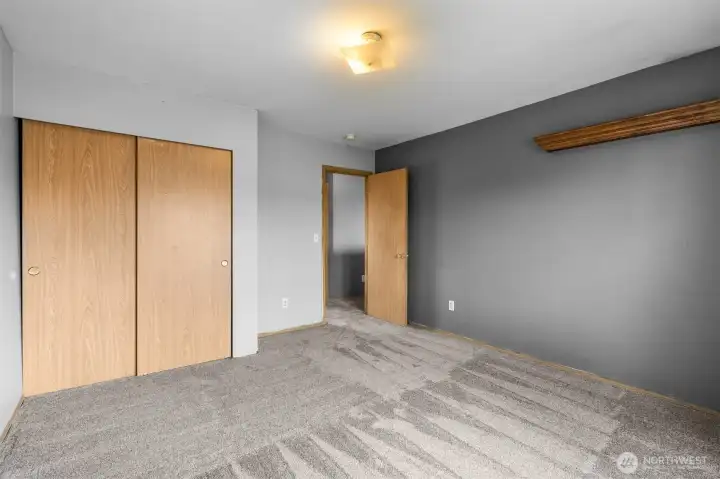 A comfortable secondary bedroom with great natural light and closet space
