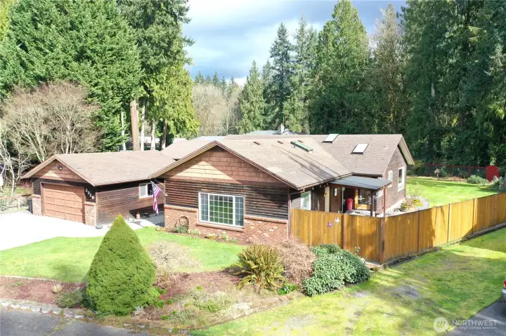 Beautiful Rambler on .56 of an acre lot w/salmon spawning creek just through the trees on the property!