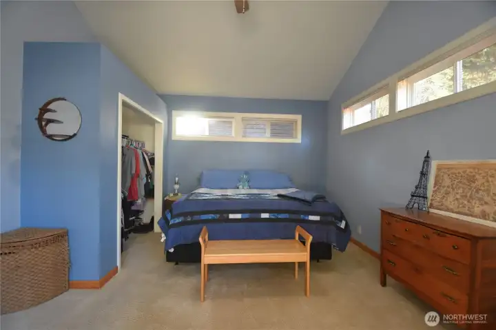 Primary bedroom is large w/lots of closet space and natural lighting/windows.