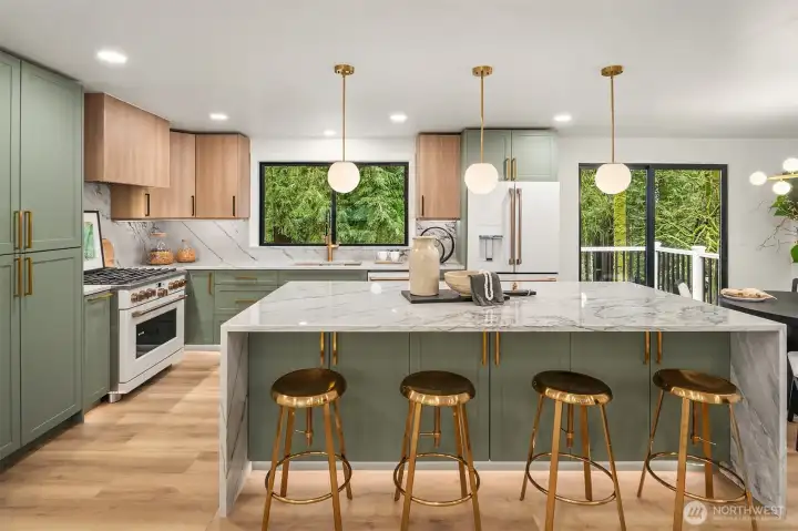 Fully renovated kitchen with Cafe appliances, custom cabinetry, hardware and quartzite hard surfaces.