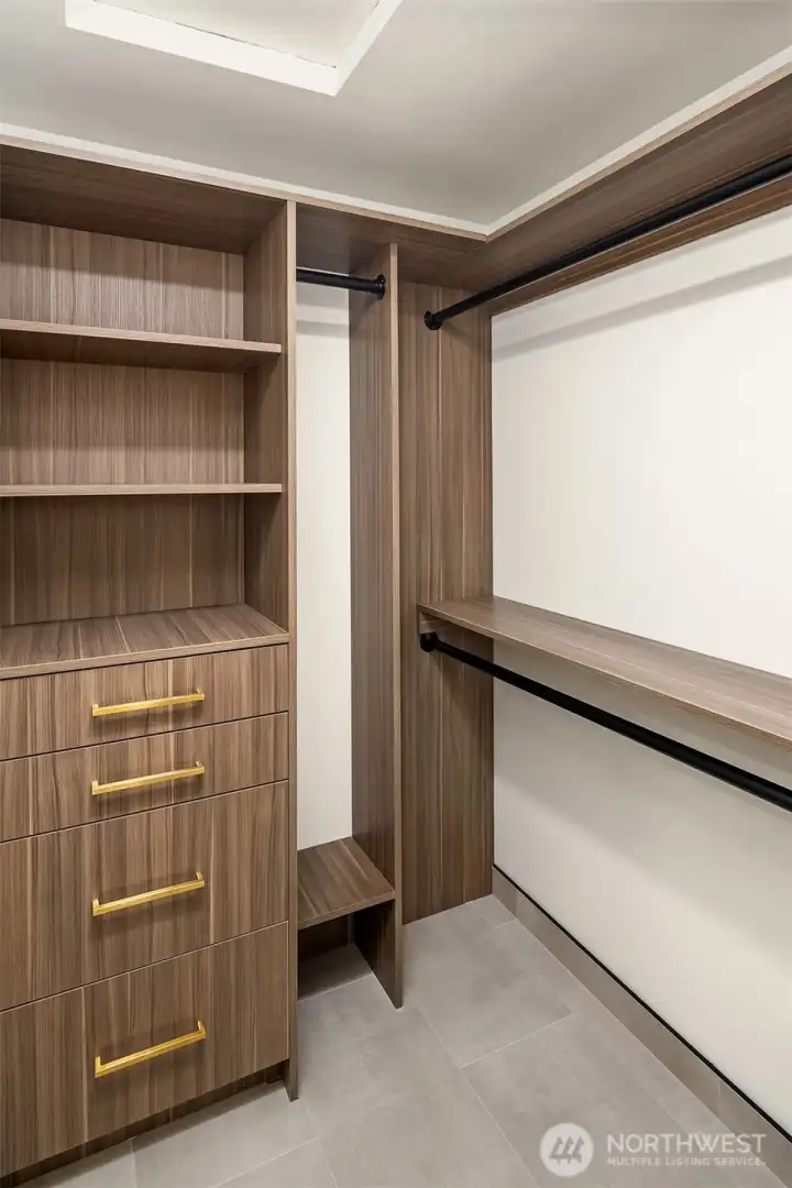 Custom walk-in closet in primary.