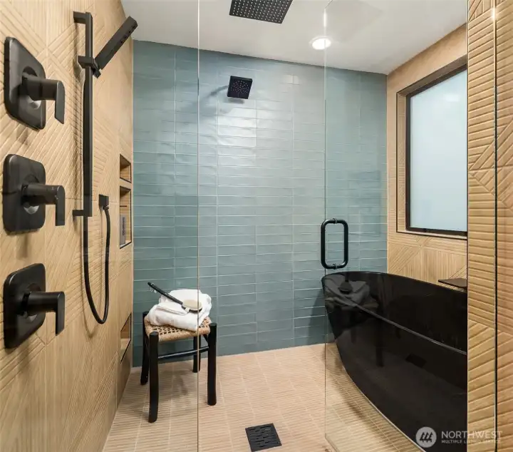 Wet room with floor to ceiling tile.