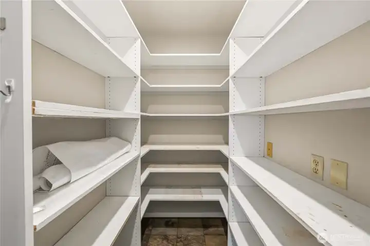 Walk-in pantry for ample storage.