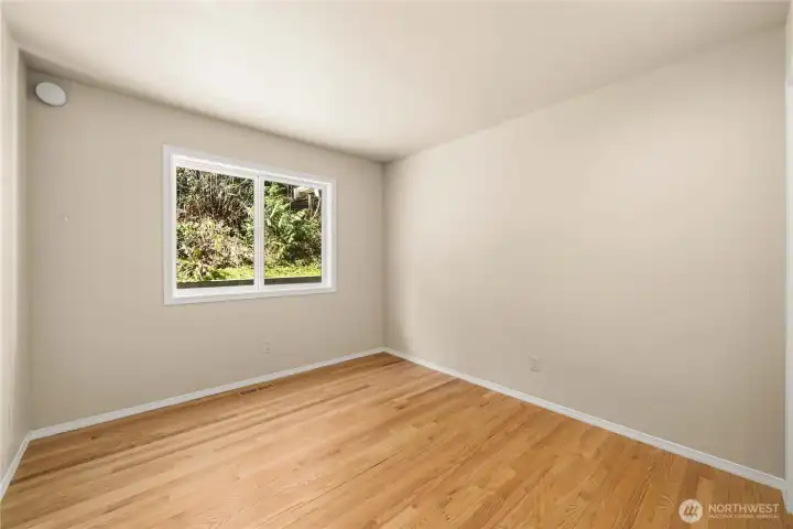 Light and airy secondary bedroom on the main floor.