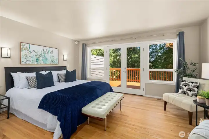 Private primary retreat with calming views and direct access to the deck.